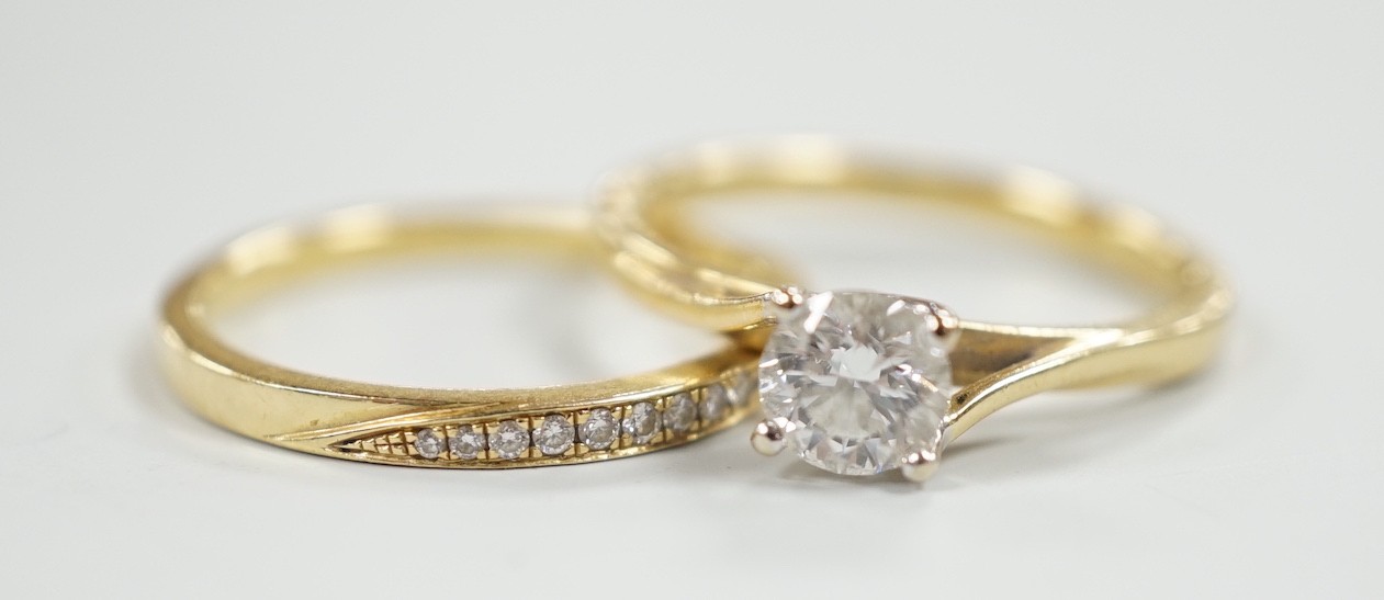 A modern Parkhouse 18ct gold wedding set, comprising a graduated ten stone diamond chip set half hoop band and an Isabella solitaire diamond ring, the latter with accompanying GIA report dated 4/12/2014, stating the ston